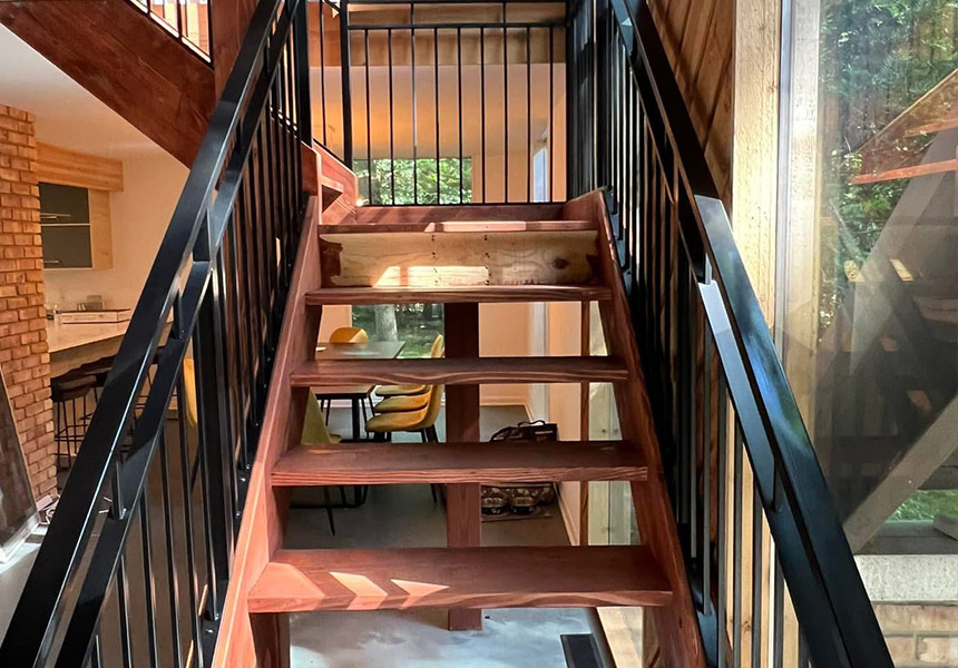 Black metal railings around an exterior staircase
