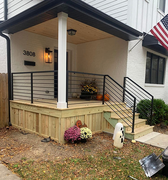 Black metal railing on a residential porch